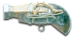 Soft metal netsuke cast in the form of a match-lock pistol, Meiji Period, sold at auction in 1997 for  alt=