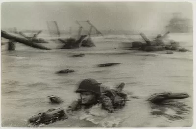 Normandy Invasion on D‐Day, Soldier Advancing through Surf, 1944 Robert Capa © International Center of Photography / Magnum Photos