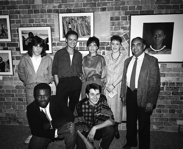 NADOC 86 Exhibition of Aboriginal and Islander Photographers, Aboriginal Artists Gallery, Sydney, 1986. Back row: Darren Kemp, Michael Riley, Tracey Moffatt, Brenda L. Croft, Mervyn Bishop; front row: Tony Davis, Chris Robinson. Photograph by William Yang