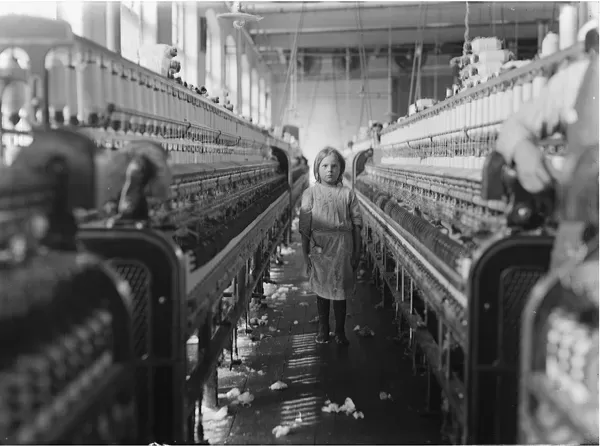 Photograph by Lewis W. Hine of a small spinner at Mollohan Mills, Newberry, S.C