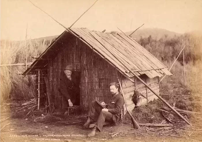 Burton and Payton are pictured here outside a whare in Taumaranui, near the centre of the King Country. Alfred Burton, Burton Brothers Studio, Photography Collection, Museum of New Zealand Te Papa Tongarewa