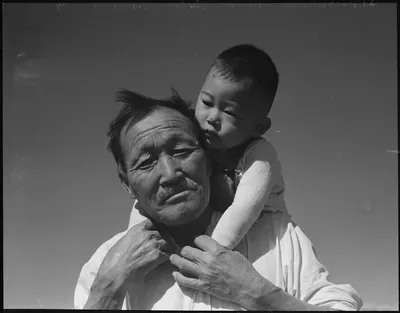 Dorothea Lange's Grandfather and Grandson of Japanese Ancestry at a War Relocation Authority Center, Manzanar, California (July 1942)
