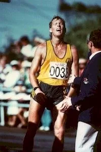 Andrew Jachno grimaces upon completing the Men's Walk where he won the Silver Medal