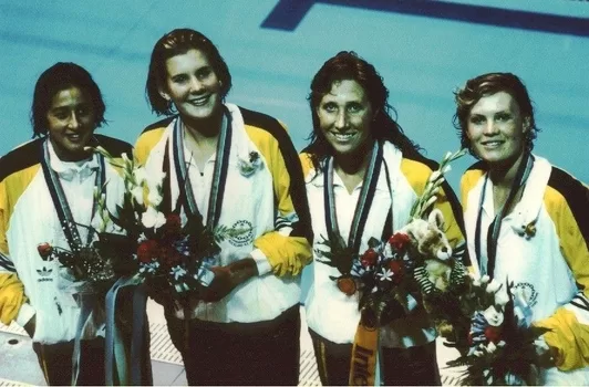 Australian Gold Medallists from left, Hayley Lewis, Jennifer McMahon, Janelle Elford and Julie McDonald poolside after receiving their Gold Medals for the Women's 4 x 200m Freestyle Relay