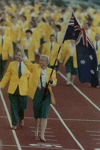 Lisa Curry-Kenny carries the Australian national flag during the Opening Ceremony in Auckland at the XIVth Commonwealth Games.