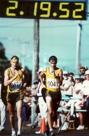 Australians Simon Baker and Paul Copeland cross the Men's Walk finish line together in 7th place